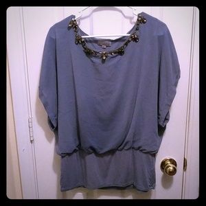 Blue shirt with jeweled neck